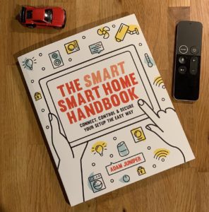 Smart Smart Home Handbook with Apple TV Remote and toy car